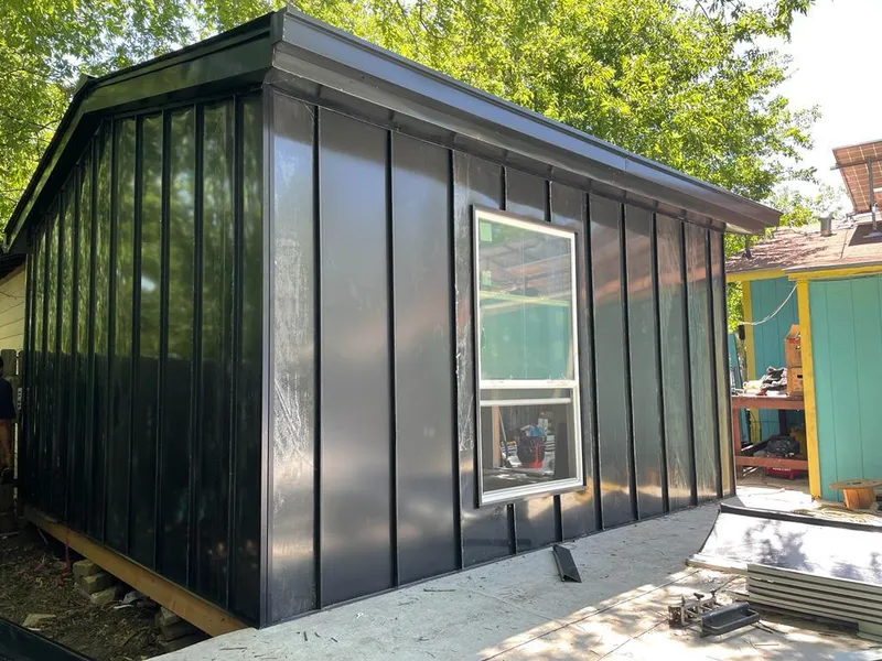 Black standing seam metal wall panels for Metal Roof Installation in Woods Cross